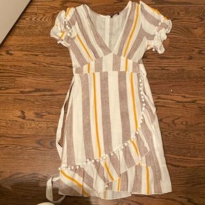 Large wrap dress with pom pom details